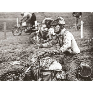 Mud-covered motocross rider