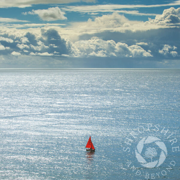 Red sailing boat, Beer, Devon. Red sailing boat greeting card
